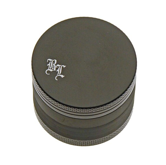 Black metal grinder with 'Black leaf logo' on top.